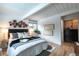 Inviting bedroom features modern lighting fixtures, comfortable bed, and stylish wall decorations at 1392 S Edison Way, Denver, CO 80222