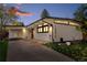 Striking modern home featuring a unique roofline, white siding, and well-manicured landscaping at 1392 S Edison Way, Denver, CO 80222