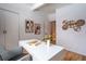 Modern office space featuring a large white desk, hardwood floors, and contemporary decorations at 1392 S Edison Way, Denver, CO 80222