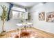 Bright home office with a white desk, hardwood floors, and a large window with natural light at 1392 S Edison Way, Denver, CO 80222