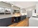 Modern kitchen with stainless steel appliances, white countertops, and stylish under-cabinet lighting at 1392 S Edison Way, Denver, CO 80222