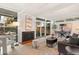 Bright living room with hardwood floors, fireplace, and access to an outdoor patio at 1392 S Edison Way, Denver, CO 80222