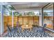 Private covered patio featuring modern furniture and stylish outdoor rugs at 1392 S Edison Way, Denver, CO 80222