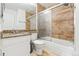 Well-lit bathroom with a shower and tub combo, granite countertops, and neutral tile floors at 14465 E Hawaii Cir # A, Aurora, CO 80012