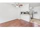 Cozy dining area featuring white walls, breakfast bar and ceiling fan at 14465 E Hawaii Cir # A, Aurora, CO 80012