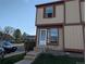 Charming townhouse featuring a two-story design with a neat front yard, steps leading to a welcoming entrance at 14465 E Hawaii Cir # A, Aurora, CO 80012