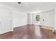 Bright, spacious living room with gleaming wood floors, and a large window at 14465 E Hawaii Cir # A, Aurora, CO 80012