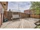 Relaxing backyard deck featuring a swing and spacious area, ideal for outdoor entertaining and leisure at 5184 E Asbury Ave, Denver, CO 80222