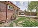 Cozy backyard featuring a wooden deck with swing and seating area, ideal for relaxation and outdoor enjoyment at 5184 E Asbury Ave, Denver, CO 80222