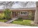 Charming brick home with landscaped front yard and inviting entryway, perfect for a cozy suburban lifestyle at 5184 E Asbury Ave, Denver, CO 80222