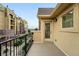 Private balcony featuring wrought iron railing with views of building exterior at 1100 Rockhurst Dr # A, Highlands Ranch, CO 80129