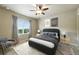 Stylishly decorated bedroom with a ceiling fan, neutral-toned walls, and modern furnishings at 1100 Rockhurst Dr # A, Highlands Ranch, CO 80129