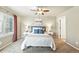 Comfortable bedroom with soft lighting, a ceiling fan, and neutral decor at 1100 Rockhurst Dr # A, Highlands Ranch, CO 80129