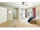 Bright bedroom features a walk-in closet, and a private patio at 1100 Rockhurst Dr # A, Highlands Ranch, CO 80129