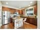 Modern kitchen features stainless steel appliances, granite countertops, and a breakfast bar at 1100 Rockhurst Dr # A, Highlands Ranch, CO 80129