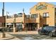 Exterior view of Lansdowne Arms Bistro and Pub, featuring outdoor seating and a charming brick facade at 1100 Rockhurst Dr # A, Highlands Ranch, CO 80129