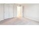 Bedroom featuring sliding door closet, open doorway, and carpet at 19058 E 94Th Pl, Commerce City, CO 80022