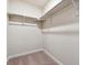 Walk-in closet featuring carpeted floors, white walls and built-in shelving at 19058 E 94Th Pl, Commerce City, CO 80022