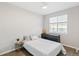 Bright bedroom with a double bed, dresser, and window coverings at 16058 E Geddes Ln # 26, Aurora, CO 80016