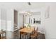 Modern dining area with wood table and access to the kitchen at 16058 E Geddes Ln # 26, Aurora, CO 80016