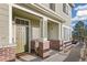 Inviting front porch and walkway leading to the entrance of this charming townhome at 16058 E Geddes Ln # 26, Aurora, CO 80016