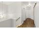 Bright hallway with wood floors and doors at 16058 E Geddes Ln # 26, Aurora, CO 80016