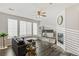 Open concept living room with large windows and fireplace at 16058 E Geddes Ln # 26, Aurora, CO 80016