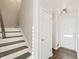 Clean lines and dark wood accents on the staircase at 16058 E Geddes Ln # 26, Aurora, CO 80016