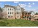Expansive backyard with lush lawn, brick patio, and multi-level deck, perfect for entertaining at 20363 E Top T Ranch Pl, Parker, CO 80134