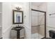 Elegant bathroom featuring a pedestal sink, tiled walk-in shower, and detailed molding at 20363 E Top T Ranch Pl, Parker, CO 80134