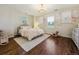 Charming bedroom with hardwood floors, elegant decor, and a stylish chandelier at 20363 E Top T Ranch Pl, Parker, CO 80134