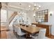 Elegant dining room with coffered ceiling, hardwood floors, and a grand table, perfect for gatherings and entertaining guests at 20363 E Top T Ranch Pl, Parker, CO 80134