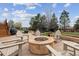 Outdoor fire pit area with stone surround and Adirondack chairs for relaxing evenings at 20363 E Top T Ranch Pl, Parker, CO 80134