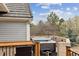 Outdoor hot tub with privacy walls, a wood surround, and views of trees and the sky at 20363 E Top T Ranch Pl, Parker, CO 80134