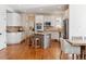 Well-appointed kitchen with white cabinets, granite countertops, and an island with seating at 20363 E Top T Ranch Pl, Parker, CO 80134