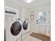 Convenient laundry room with modern appliances and ample storage space at 20363 E Top T Ranch Pl, Parker, CO 80134