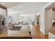 Open-concept living space with kitchen island, dining area, and living room at 20363 E Top T Ranch Pl, Parker, CO 80134