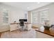 Bright office space with hardwood floors, neutral walls, custom shutters, and functional desk and storage solutions at 20363 E Top T Ranch Pl, Parker, CO 80134