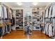 Large walk-in closet with built-in shelving and organized storage for shoes and clothes at 20363 E Top T Ranch Pl, Parker, CO 80134