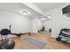 Home workout room featuring mirrored closet doors and exercise equipment on wood-look flooring at 20363 E Top T Ranch Pl, Parker, CO 80134