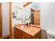 Copper sink and wooden vanity in bathroom at 26347 De Berry St, Conifer, CO 80433