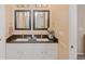 Bathroom with double vanity and dark countertop at 11931 Fairplay St, Commerce City, CO 80603