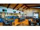 Spacious interior with high ceilings, wood floors, modern lighting and bar area at 3109 Newfound Lake Rd, Berthoud, CO 80513