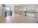 Loft area showcasing hardwood floors, with scenic mountain views from multiple windows at 3109 Newfound Lake Rd, Berthoud, CO 80513