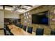Elegant private dining room with wine storage and large screen at 3109 Newfound Lake Rd, Berthoud, CO 80513