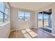 Bright room with natural light showcasing hardwood floors and sliding glass doors to patio at 3109 Newfound Lake Rd, Berthoud, CO 80513