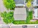 Bird's-eye view of the property featuring a well-maintained roof, a manicured lawn, and mature trees at 11803 W Tufts Pl, Morrison, CO 80465