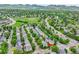 Beautiful aerial shot showcases property in a green neighborhood with easy access to parks and recreation areas at 11803 W Tufts Pl, Morrison, CO 80465