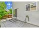 A view of the home's exterior and sliding glass door leading to a patio, ideal for outdoor living at 11803 W Tufts Pl, Morrison, CO 80465