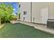 A fenced backyard with artificial turf and a small patio area at 11803 W Tufts Pl, Morrison, CO 80465